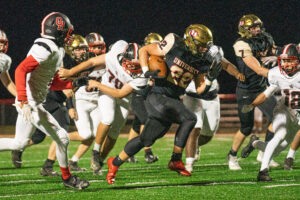 A PERFECT 10-0: University caps unbeaten regular season behind Luke Hudson in 63-21 win over Oak Hill